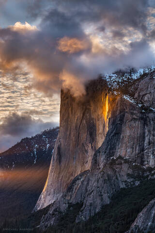 Horsetail Fall glows at sunset on the face of El Capitan in Yosemite Valley, Yosemite National Park.