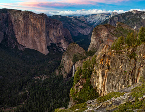 From Yosemite's Stanford Point, the view includes an eagle-eye spy of Bridalveil Fall, Sentinel Rocks, El Cap, Half Dome, and distant Tenaya Canyon.