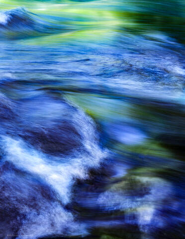 Vibrant green and blues mix in this long exposure of the Merced River in Yosemite Valley on a spring day.
