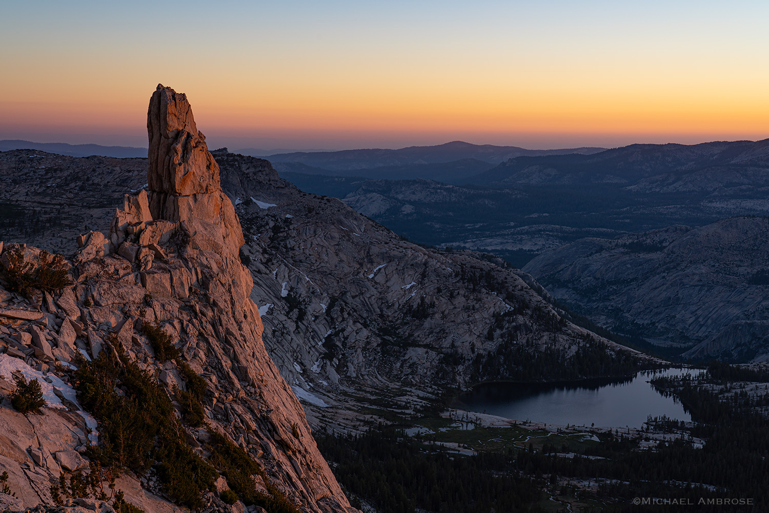 The Eichorn Pinnacle of Cathedral Peak in Yosemite National Park glows at sunset.