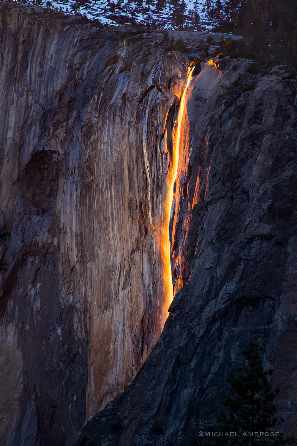 Horsetail Fall glows orange as it drops off El Capitan in Yosemite National Park