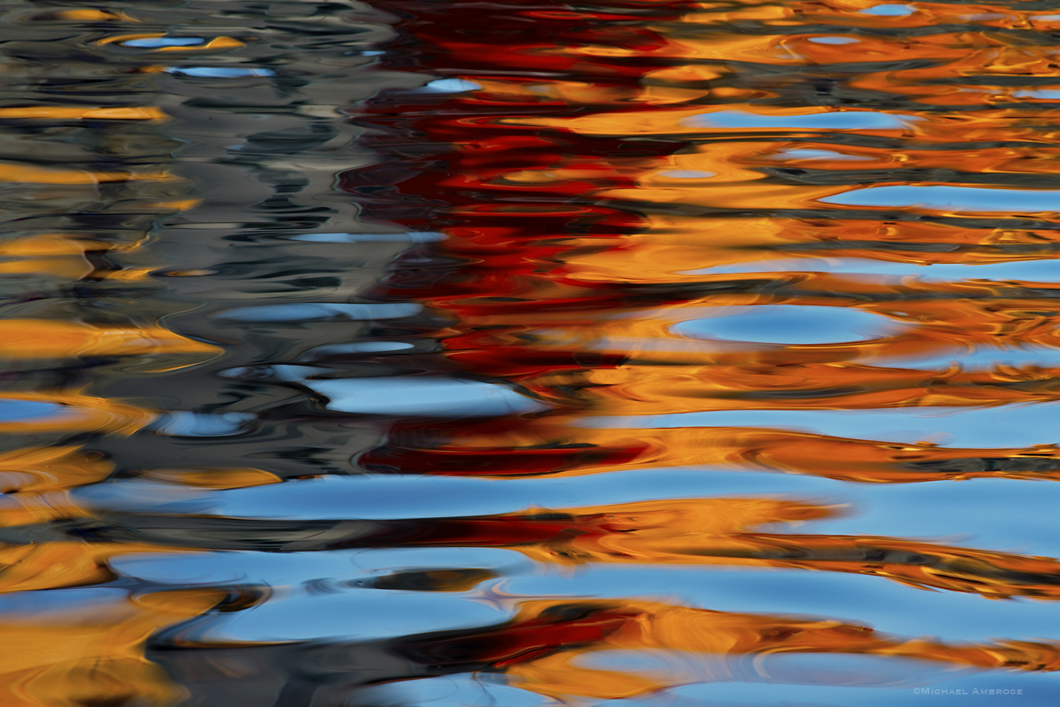 Vibrant colors reflect from the Croatian village of Rovinj into the Adriatic Sea to form their stunning abstract art photograph.