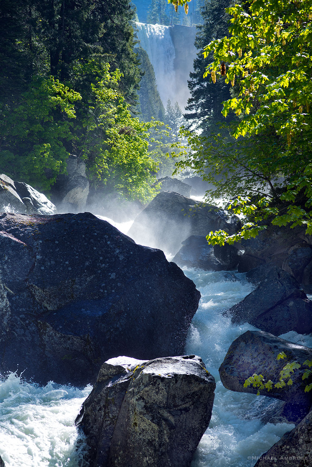 On the Mist Trail in Yosemite, Vernal Fall is spring is lush, green, and fully of spray.