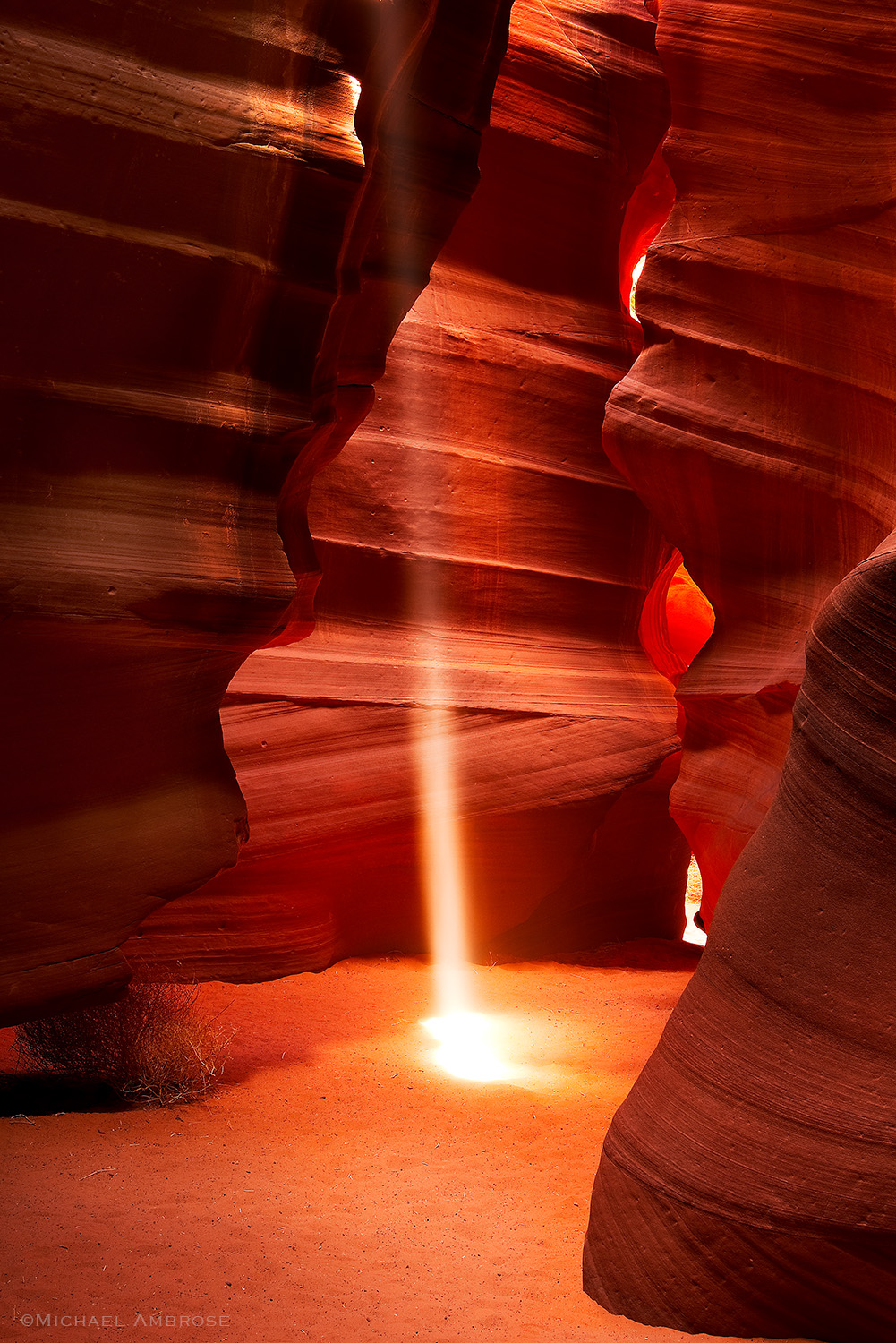 A beam of light cuts through the slot canyon of sandstone at Antelope Canyon in Page, Arizona.