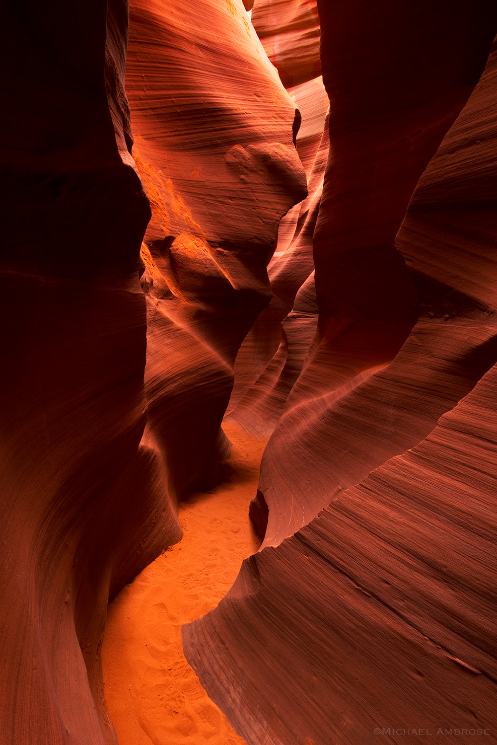 Narrow passageways wind through sandstone in this perfect example of a slot canyon in Antelope Canyon, Arizona.
