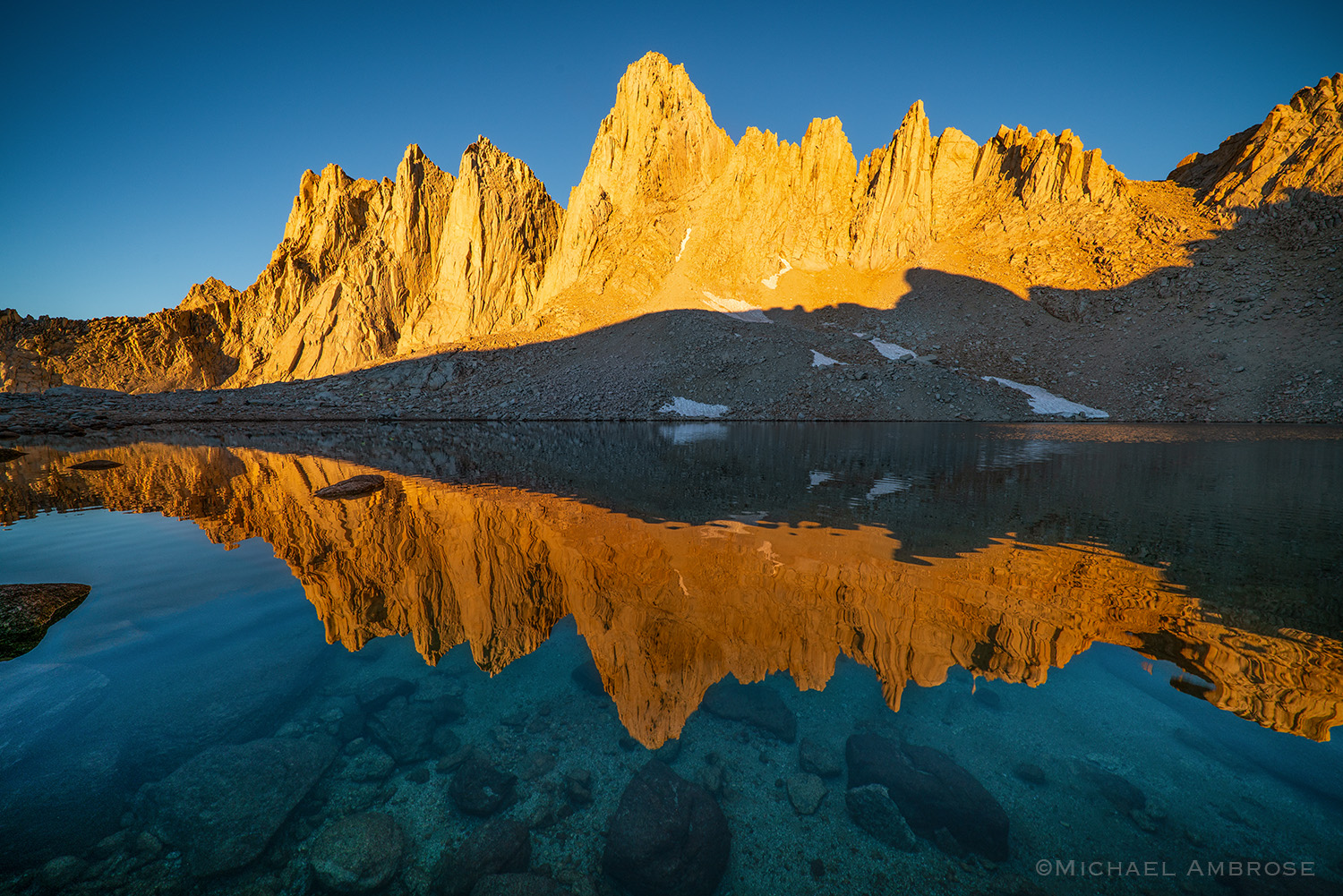 Mount Whitney reflects in Iceberg Lake in California