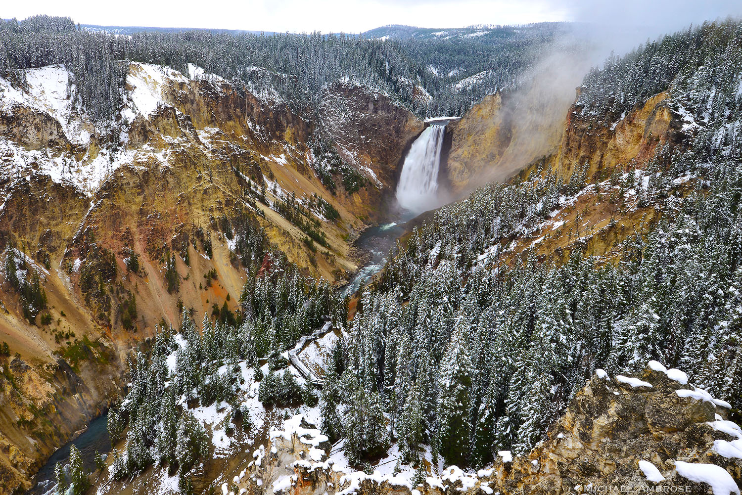 Upper falls of Yellowstone Falls in snow, Yellowstone National Park.